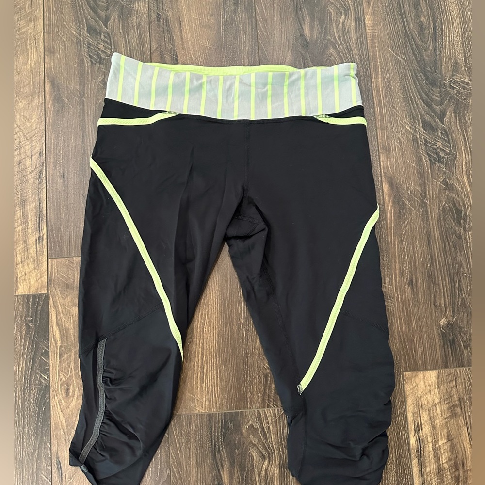 Lululemon Crop Leggings with mesh and yellow stripes